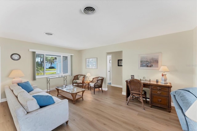 living room with light hardwood / wood-style flooring