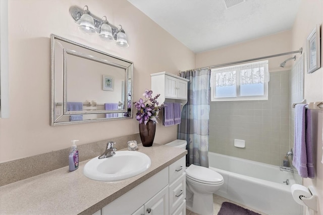 full bathroom with vanity, toilet, and shower / bath combo