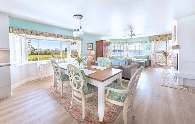 dining space featuring ceiling fan, plenty of natural light, and light hardwood / wood-style floors