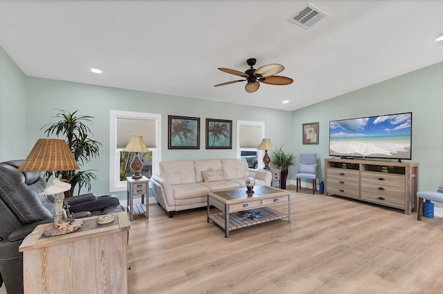 living room with ceiling fan and light wood-type flooring