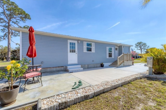 back of house featuring a patio area