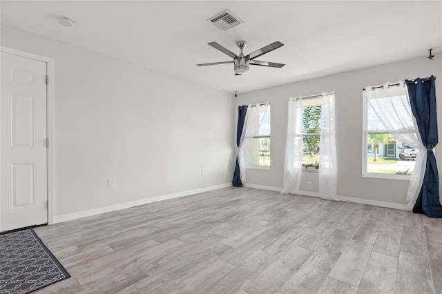 unfurnished room featuring ceiling fan and light hardwood / wood-style floors