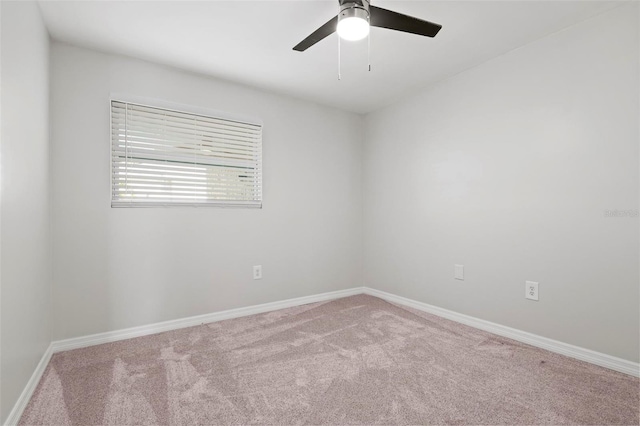 unfurnished room with ceiling fan and carpet flooring