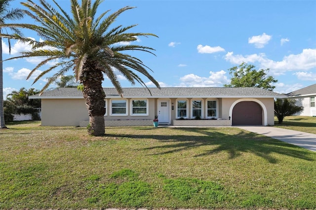 single story home with a garage and a front yard