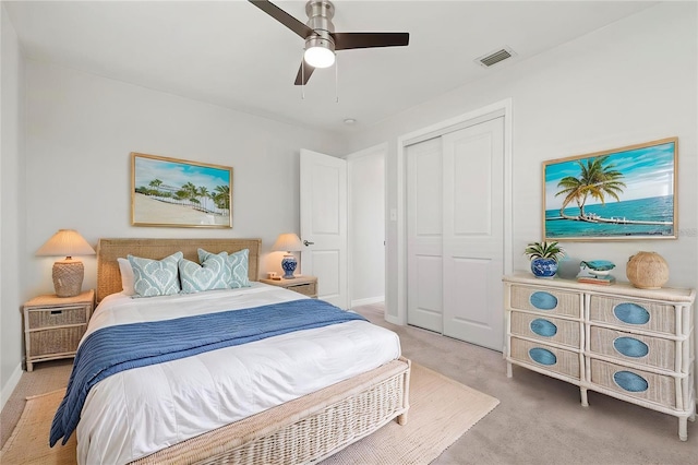 84 Caddy Rd, Rotonda West, FL 33947 - bedroom with a closet, light carpet, baseboards, and a ceiling fan