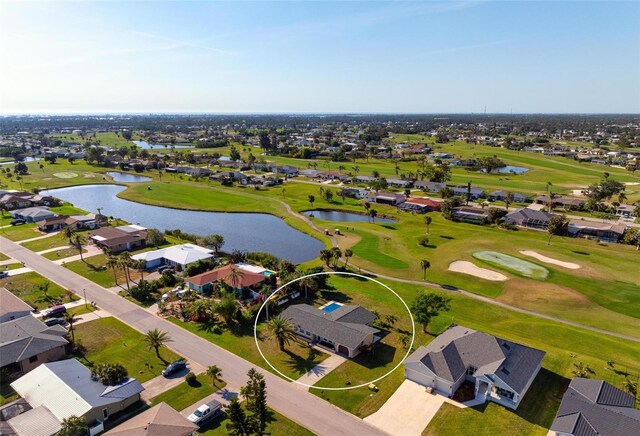 84 Caddy Rd, Rotonda West, FL 33947 - aerial view of residential area featuring a nearby body of water and a local golf course