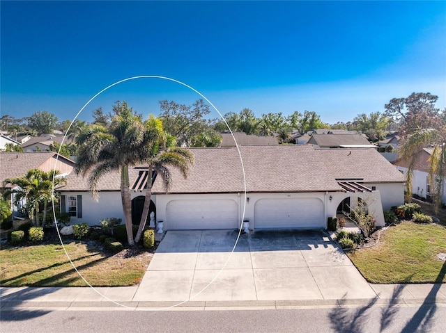 view of front of property featuring a garage and a front yard