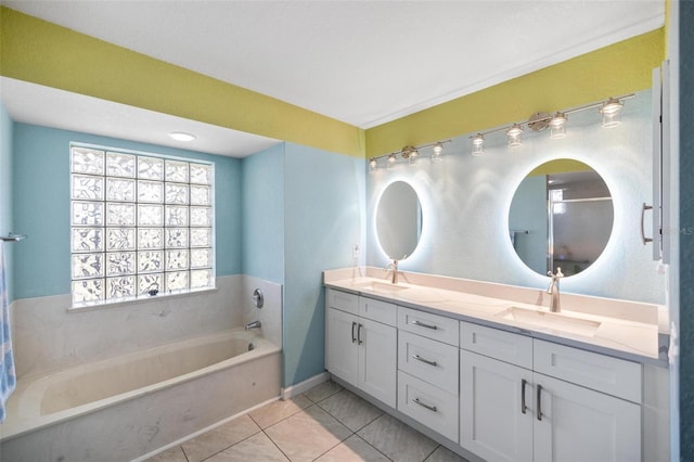 bathroom featuring vanity, tile patterned flooring, and a bathtub