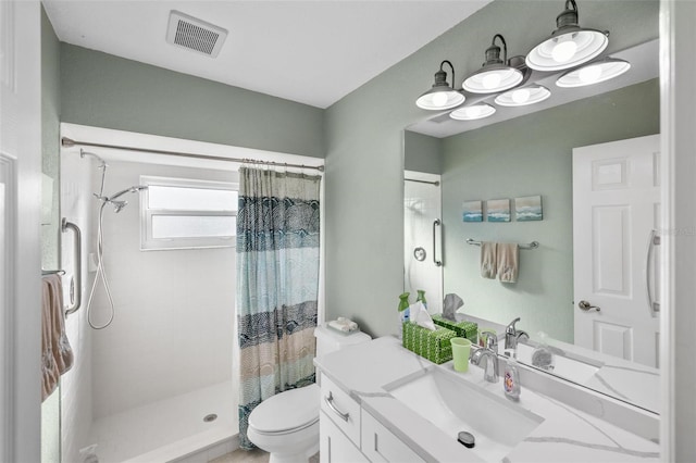 bathroom with a shower with curtain, vanity, and toilet