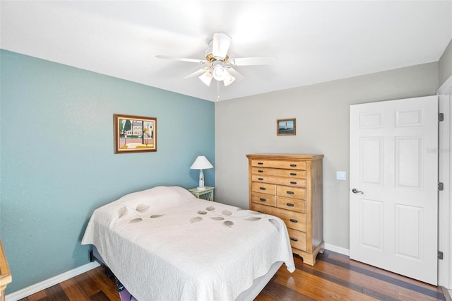 bedroom with dark wood-type flooring and ceiling fan