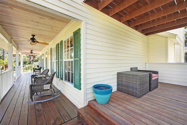 deck with covered porch and ceiling fan