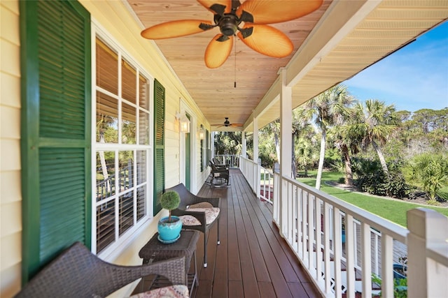 deck with ceiling fan and a porch