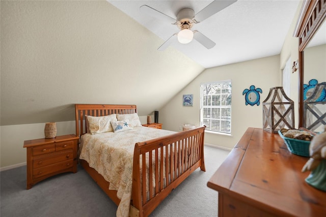 bedroom featuring light carpet, lofted ceiling, and ceiling fan