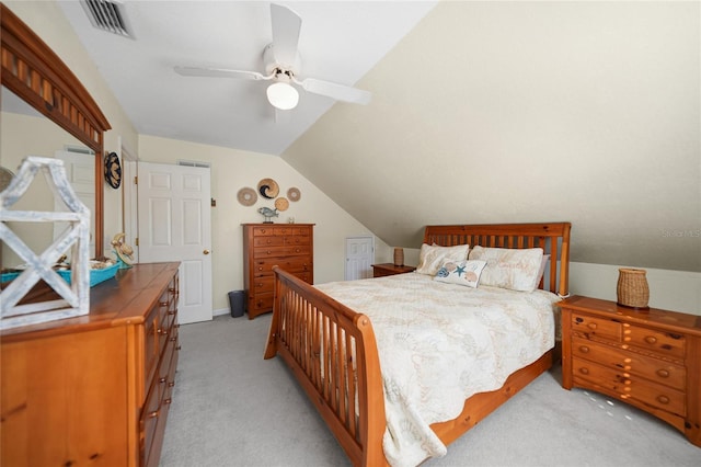 carpeted bedroom with lofted ceiling and ceiling fan