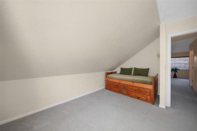 additional living space with lofted ceiling and light colored carpet