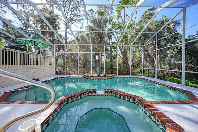 view of pool with glass enclosure