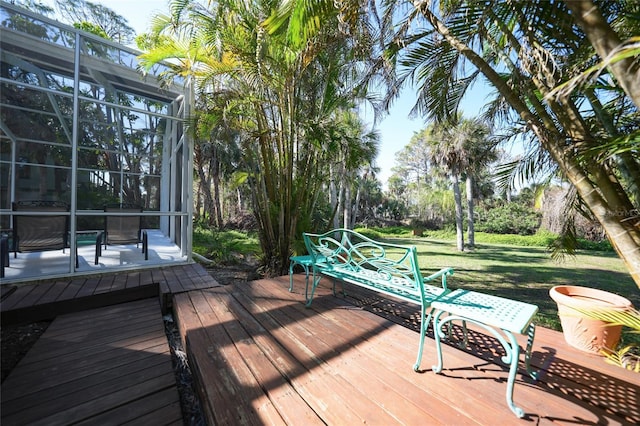 wooden terrace with a yard