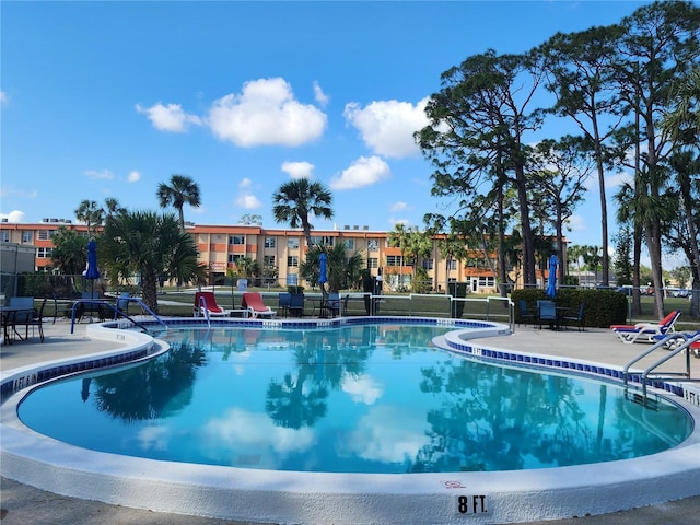 view of swimming pool with a patio area