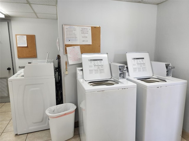 laundry area featuring light tile patterned flooring and independent washer and dryer