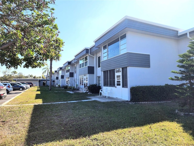 view of front of home with a front yard