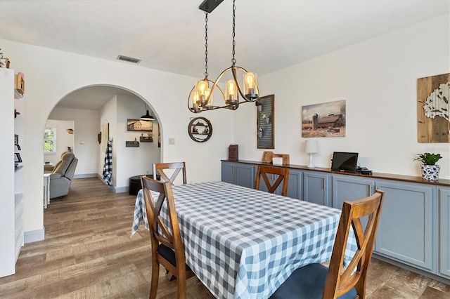 dining room with dark hardwood / wood-style flooring