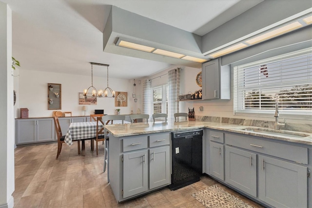 kitchen with black dishwasher, gray cabinetry, sink, hanging light fixtures, and kitchen peninsula