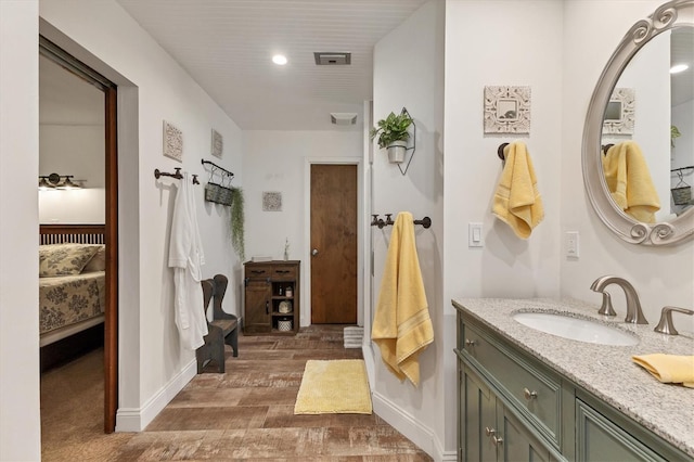 bathroom with hardwood / wood-style flooring and vanity