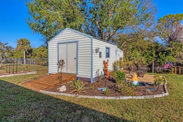 view of outbuilding featuring a yard