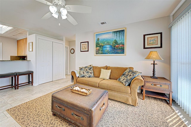 living room featuring ceiling fan