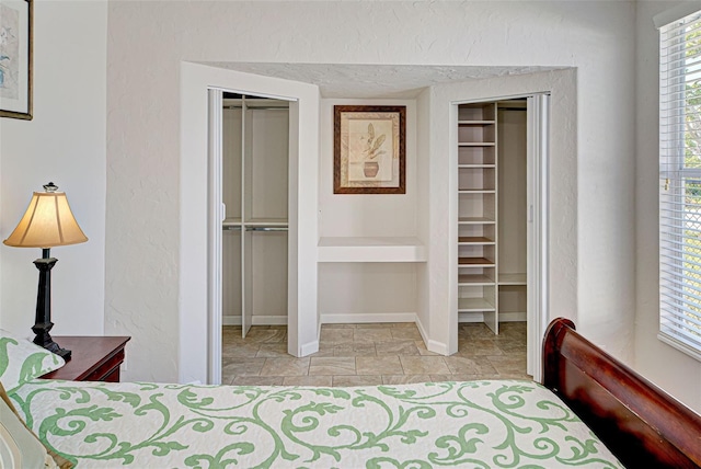 bedroom with two closets