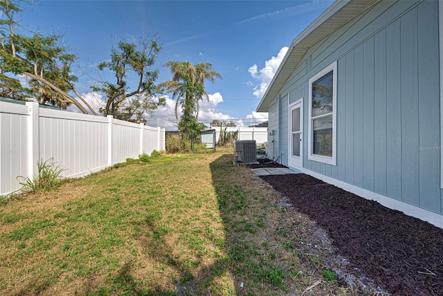 view of yard featuring central AC