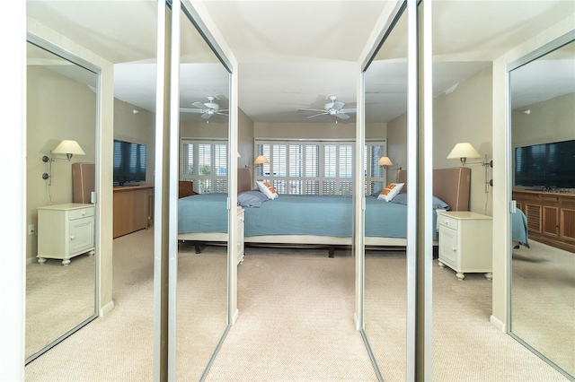 carpeted bedroom with multiple closets