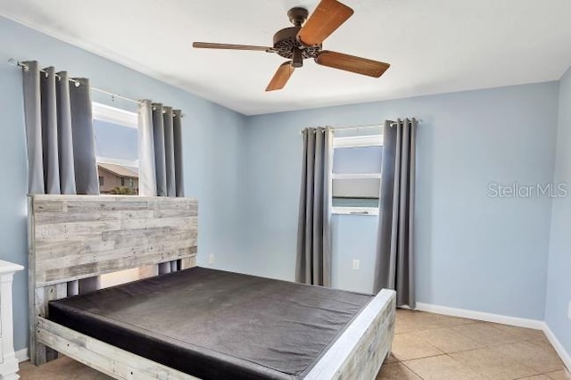 tiled bedroom with ceiling fan