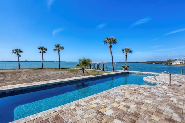 view of pool featuring a water view