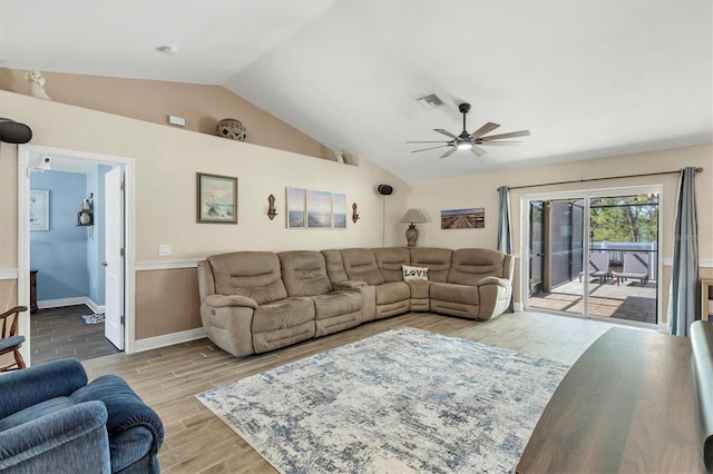 living room with vaulted ceiling, ceiling fan, and light hardwood / wood-style flooring