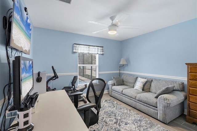 office area with hardwood / wood-style floors and ceiling fan