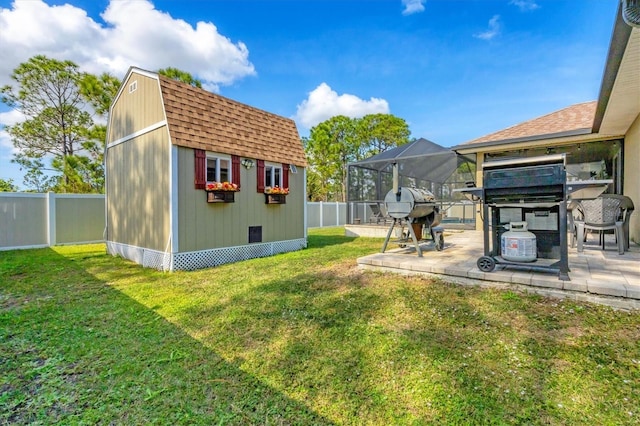 view of yard featuring a lanai and a shed