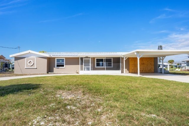 single story home with a carport and a front lawn