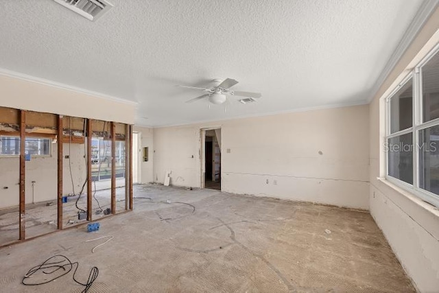 unfurnished room featuring crown molding, ceiling fan, and a textured ceiling