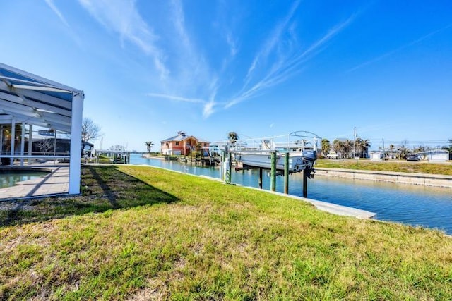 dock area featuring a lanai, a water view, and a lawn