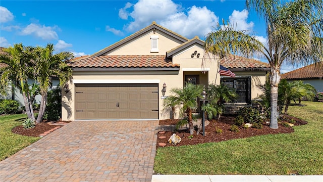 view of front of property with a front lawn and a garage