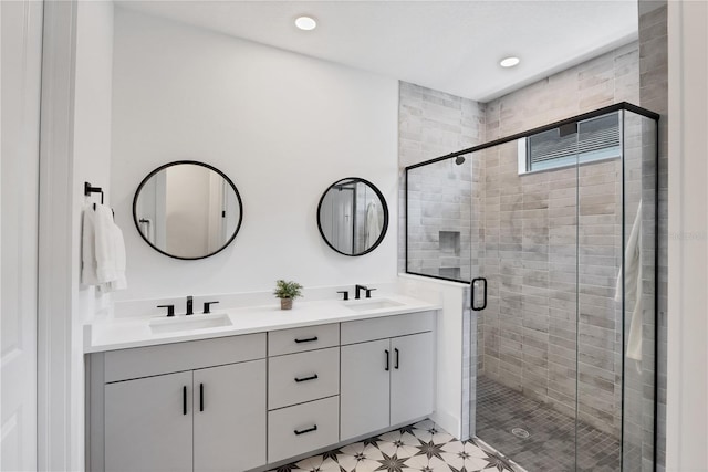 bathroom with vanity and an enclosed shower