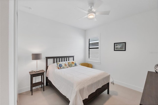 tiled bedroom with ceiling fan