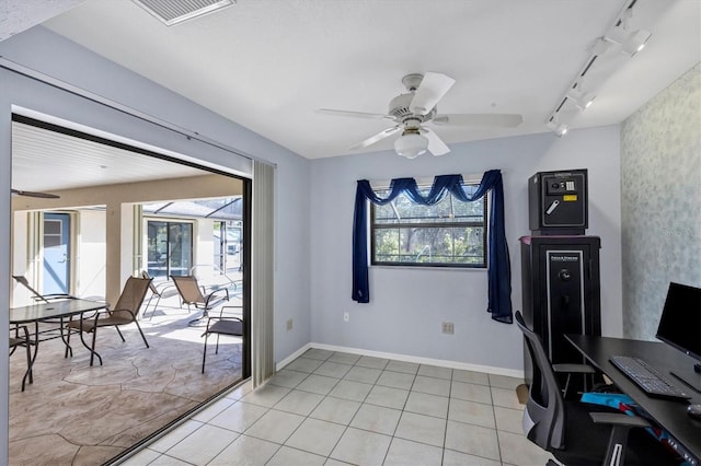 office featuring a ceiling fan, plenty of natural light, and track lighting