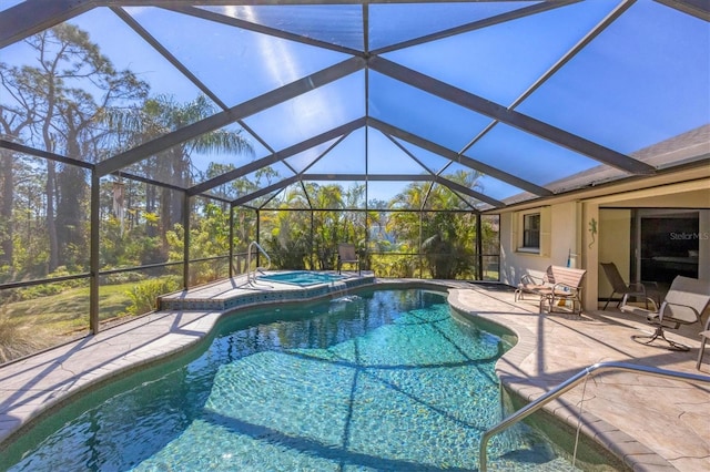 view of pool featuring a patio area and a pool with connected hot tub