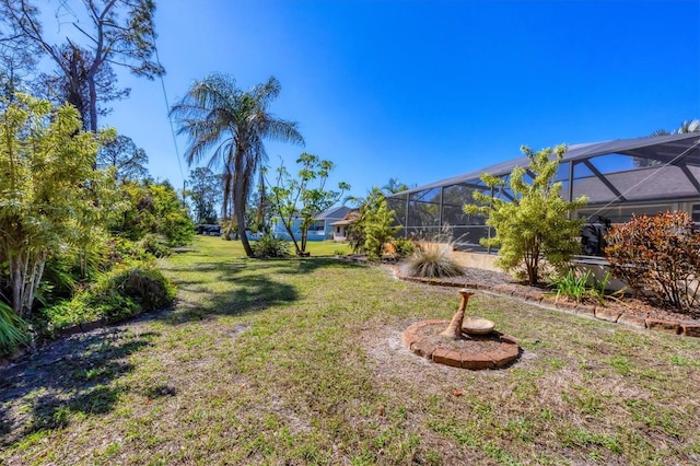 view of yard featuring a lanai