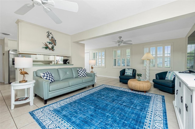 tiled living room featuring ceiling fan