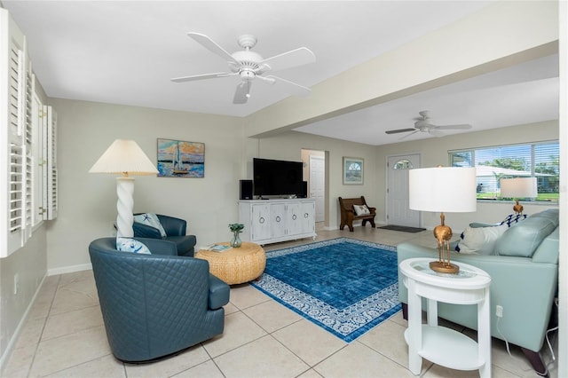 living room featuring light tile patterned floors and ceiling fan