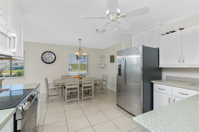 kitchen with white cabinetry, stainless steel appliances, and pendant lighting