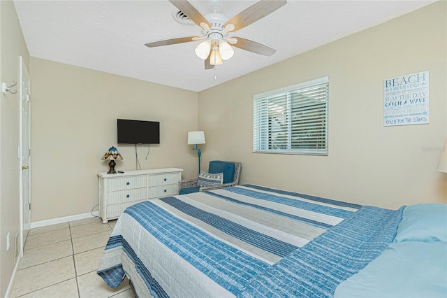 tiled bedroom with ceiling fan